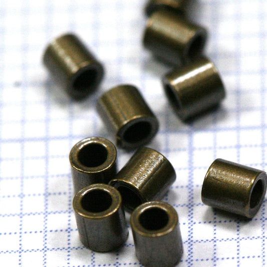 Crimp tubes, crimp beads 2x2mm 1,2mm 17 gauge inside diameter. Antique brass 1400AB-18 crmb