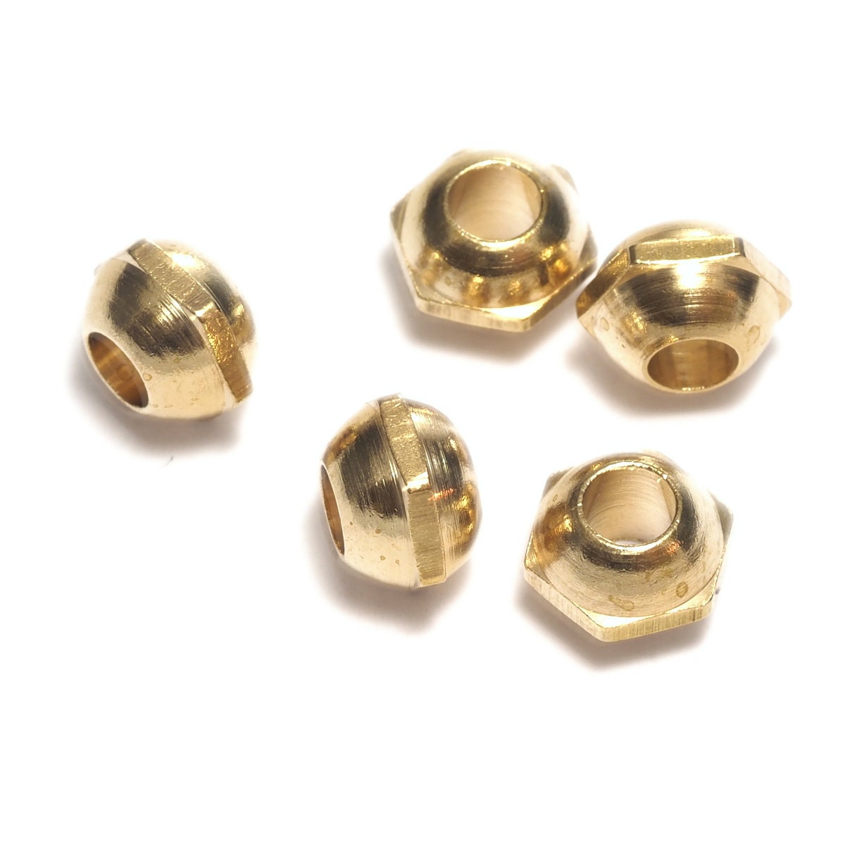 Raw brass hexagonal bead, 7x5.2mm ( 3.5mm hole)bab3.5 OZ538