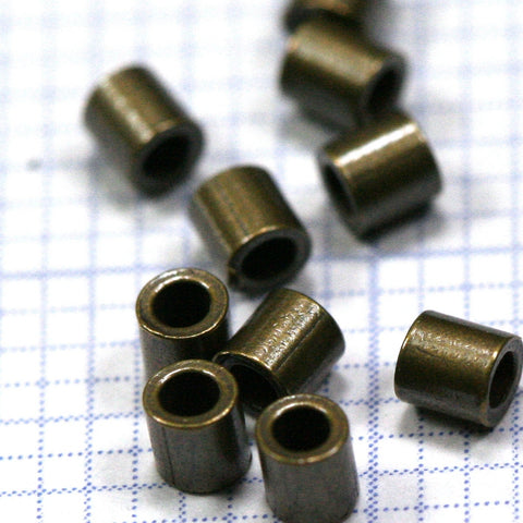 Crimp tubes, crimp beads 2x2mm  1,2mm 17 gauge inside diameter. Antique brass 1400AB-18 crmb